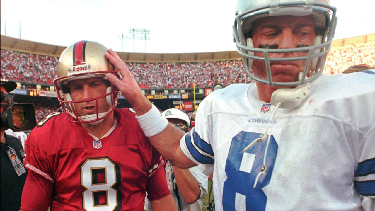 QB Steve Young, San Francisco 49ers (izquierda) y QB Troy Aikman, Dallas Cowboys (derecha)